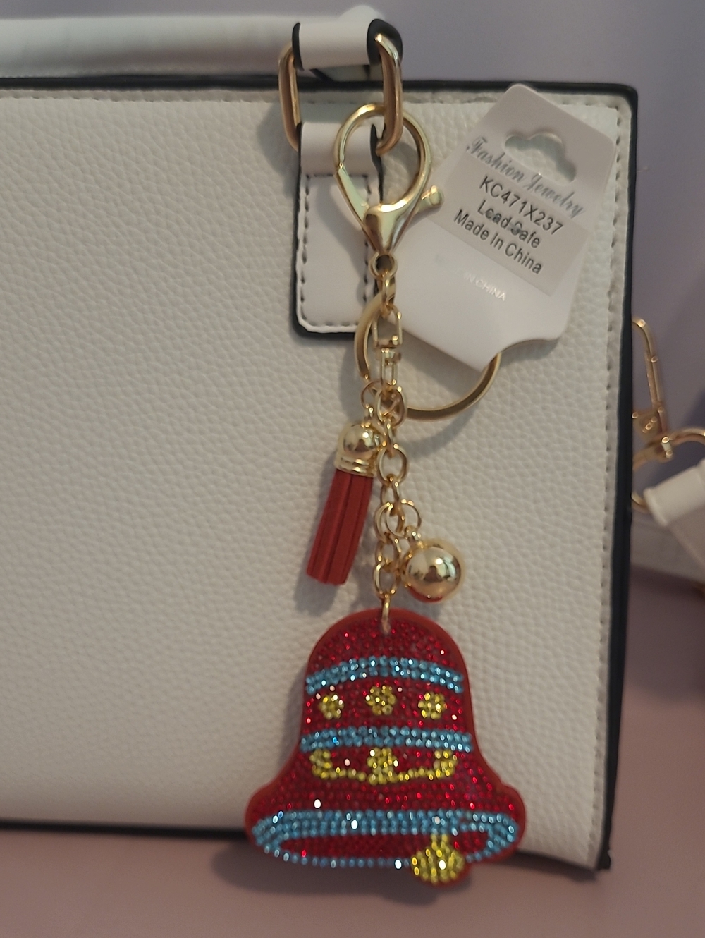 Stylish Red Bell Tassel Keychain with Gold Hardware